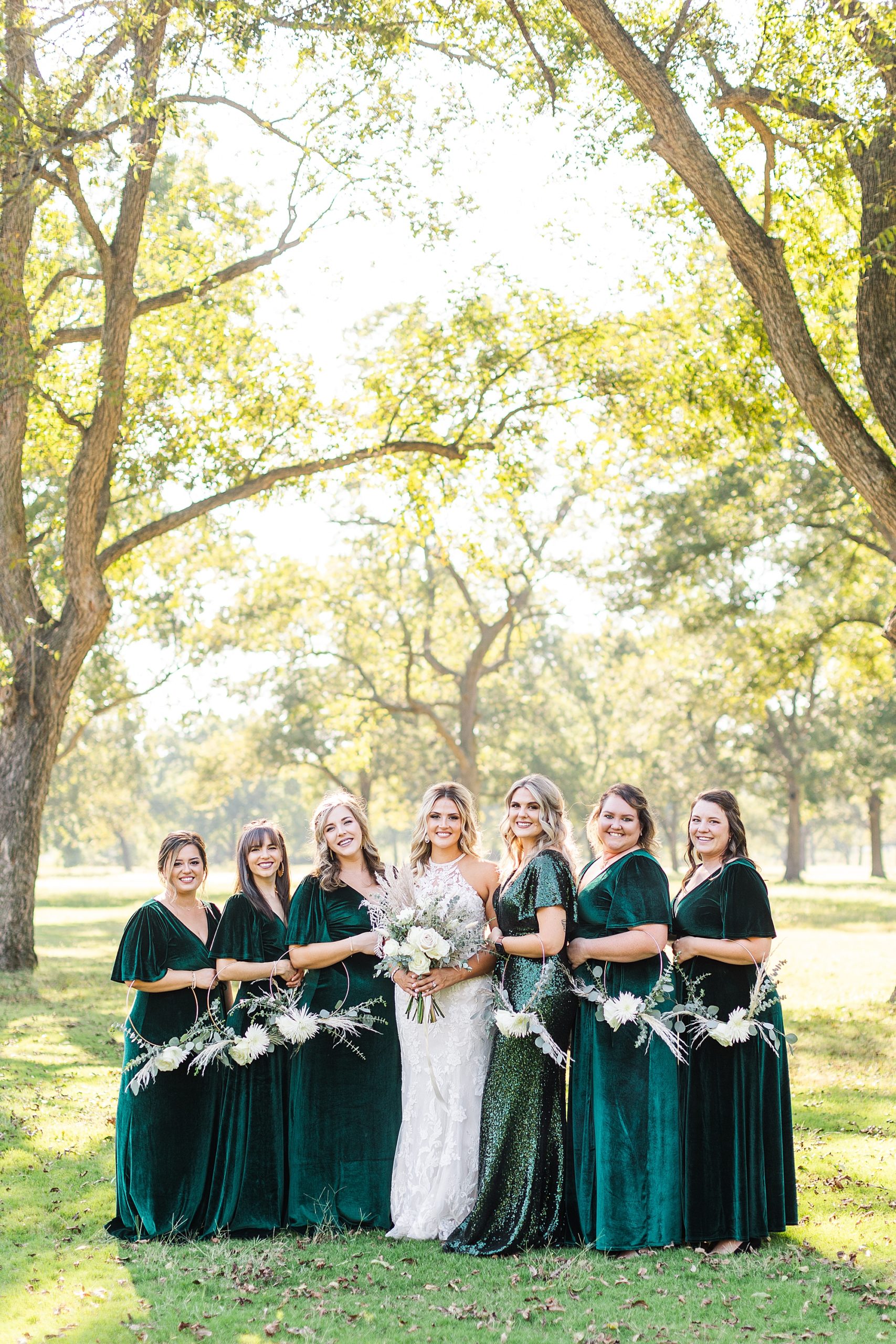 Emerald green wedding dresses at Pecandarosa Ranch wedding in the pecan grove. 