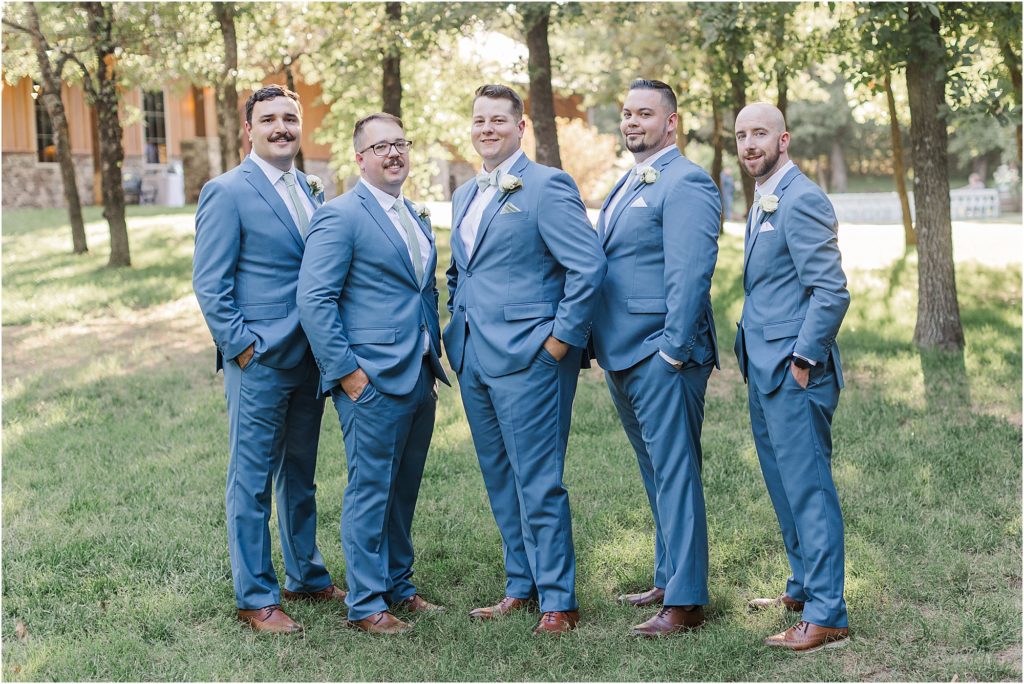 Groomsmen posing for a classic photograph at Eleven Oaks Ranch.