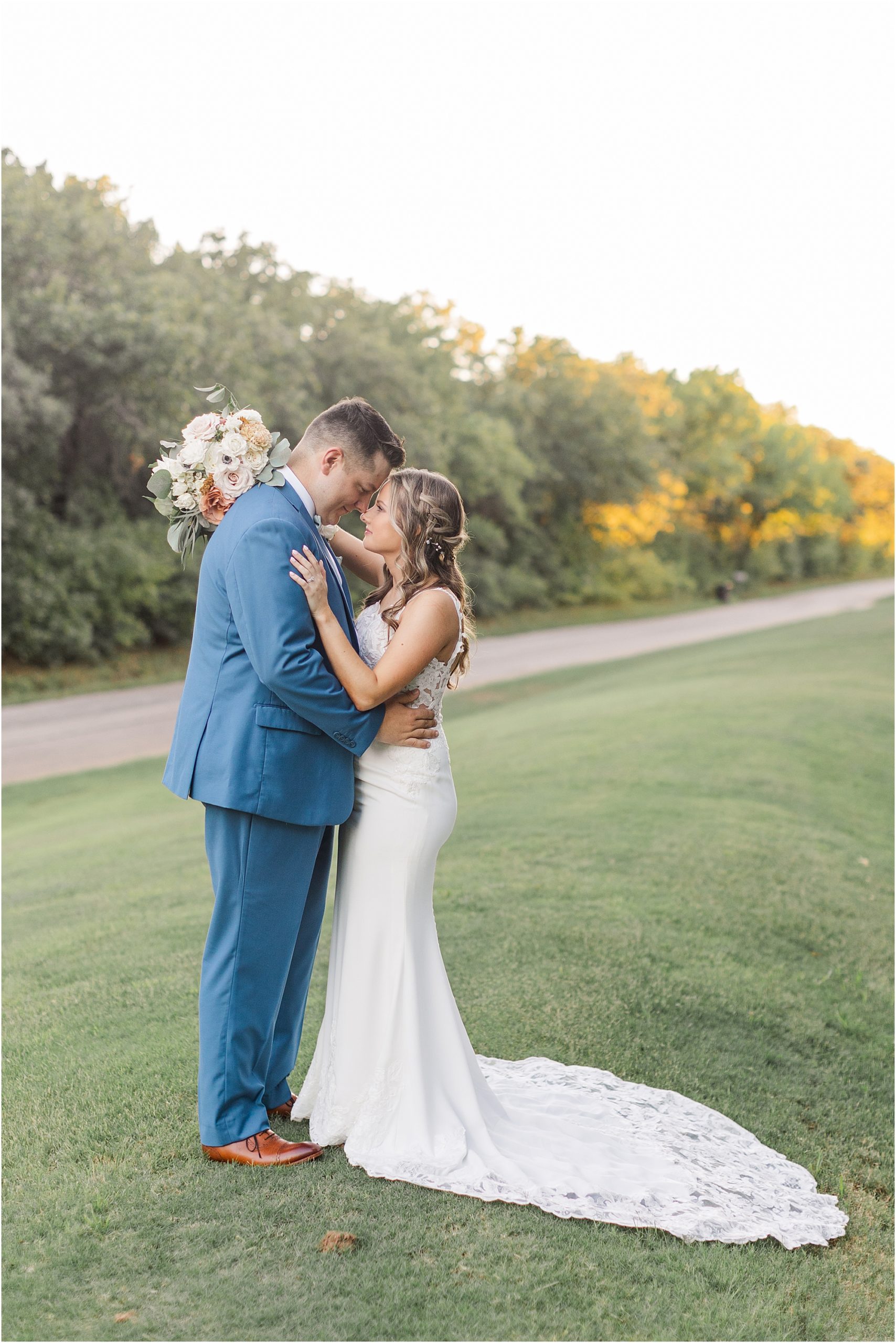A couple sharing an intimate moment at their wedding during golden hour in the woods of Luther, Oklahoma.