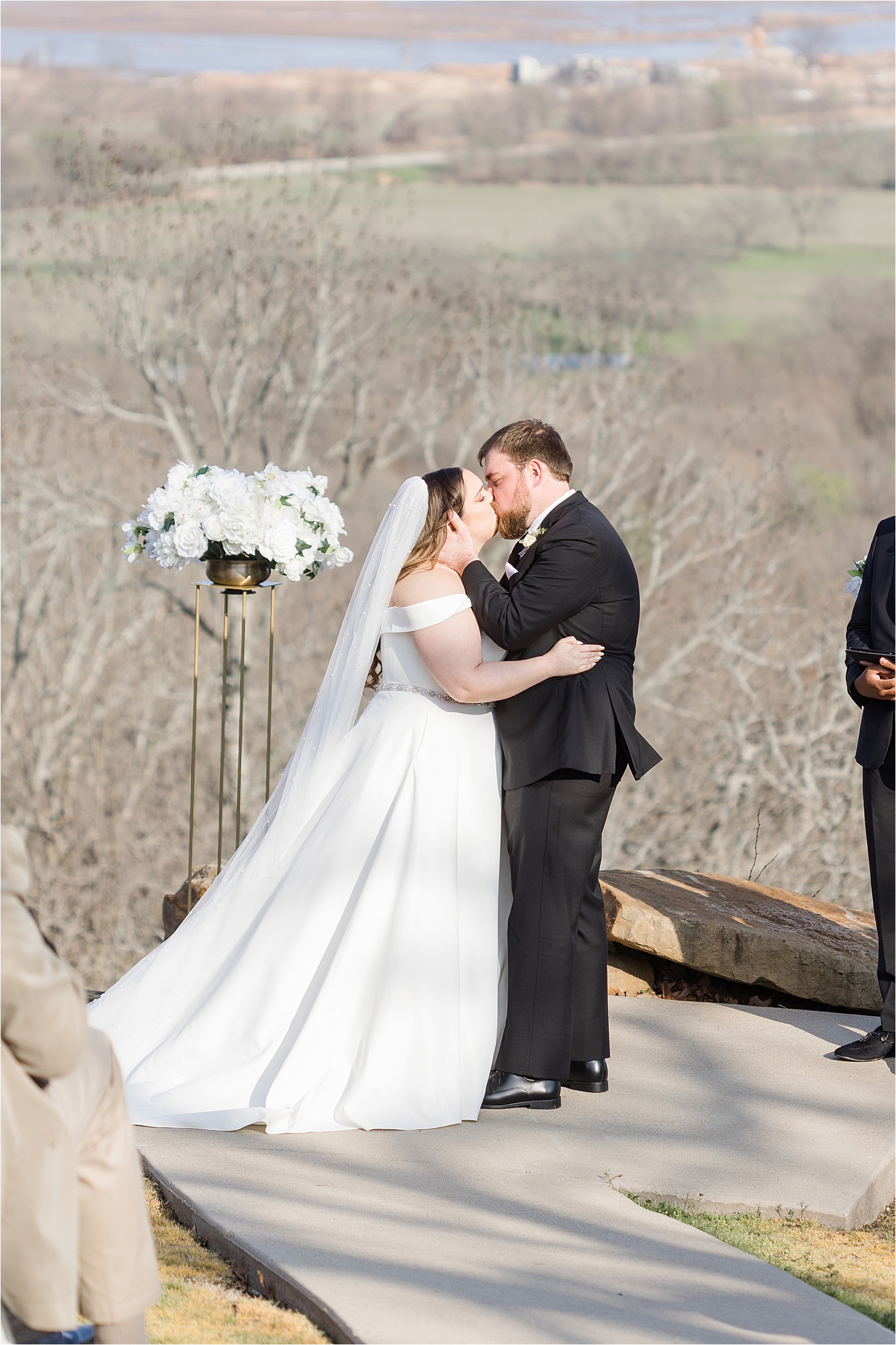 Brandi and Wade kissing at the altar of their Dream Point Ranch Wedding.