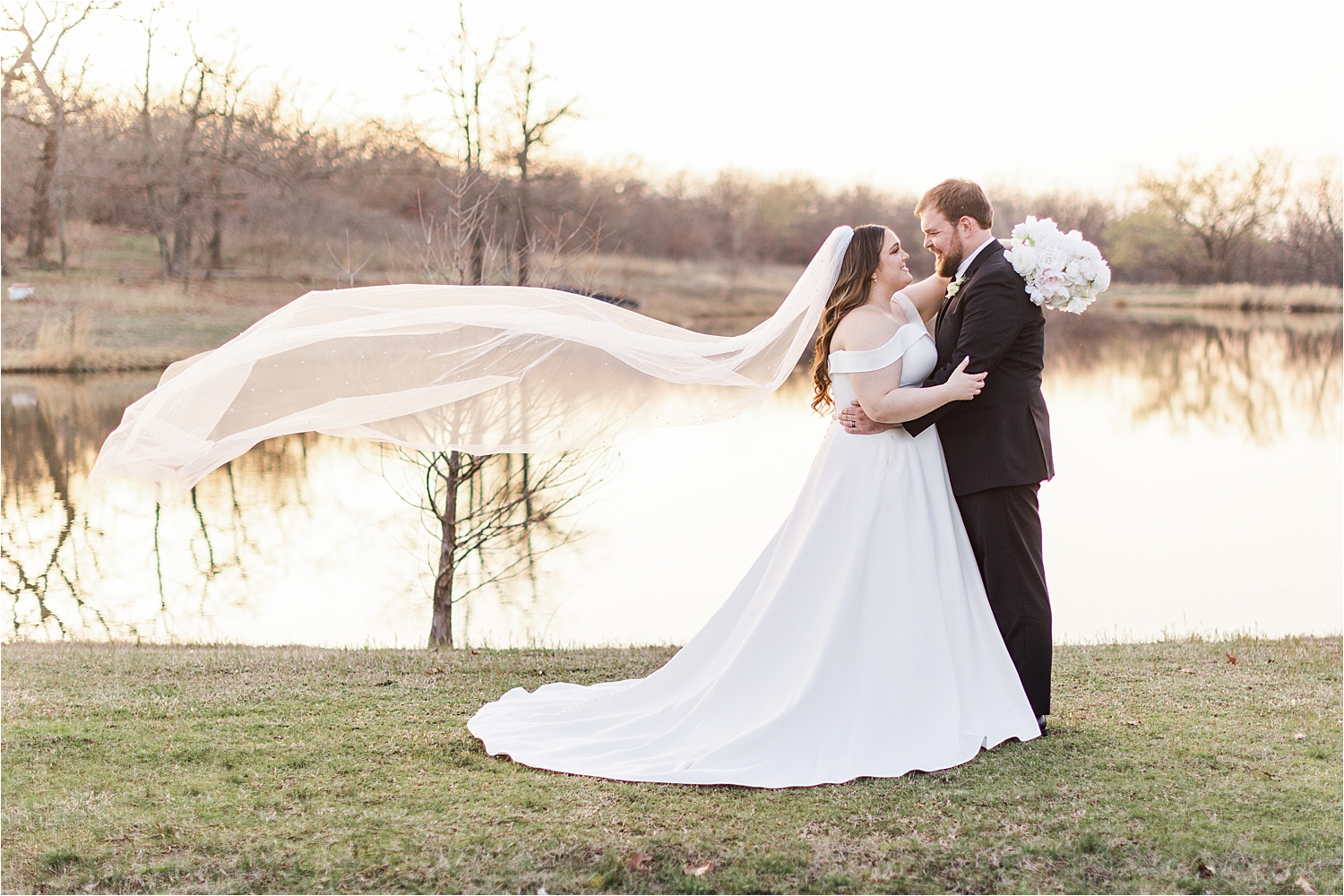 A Dream Point Ranch Wedding portrait down by the water during a glow-y sunset. 