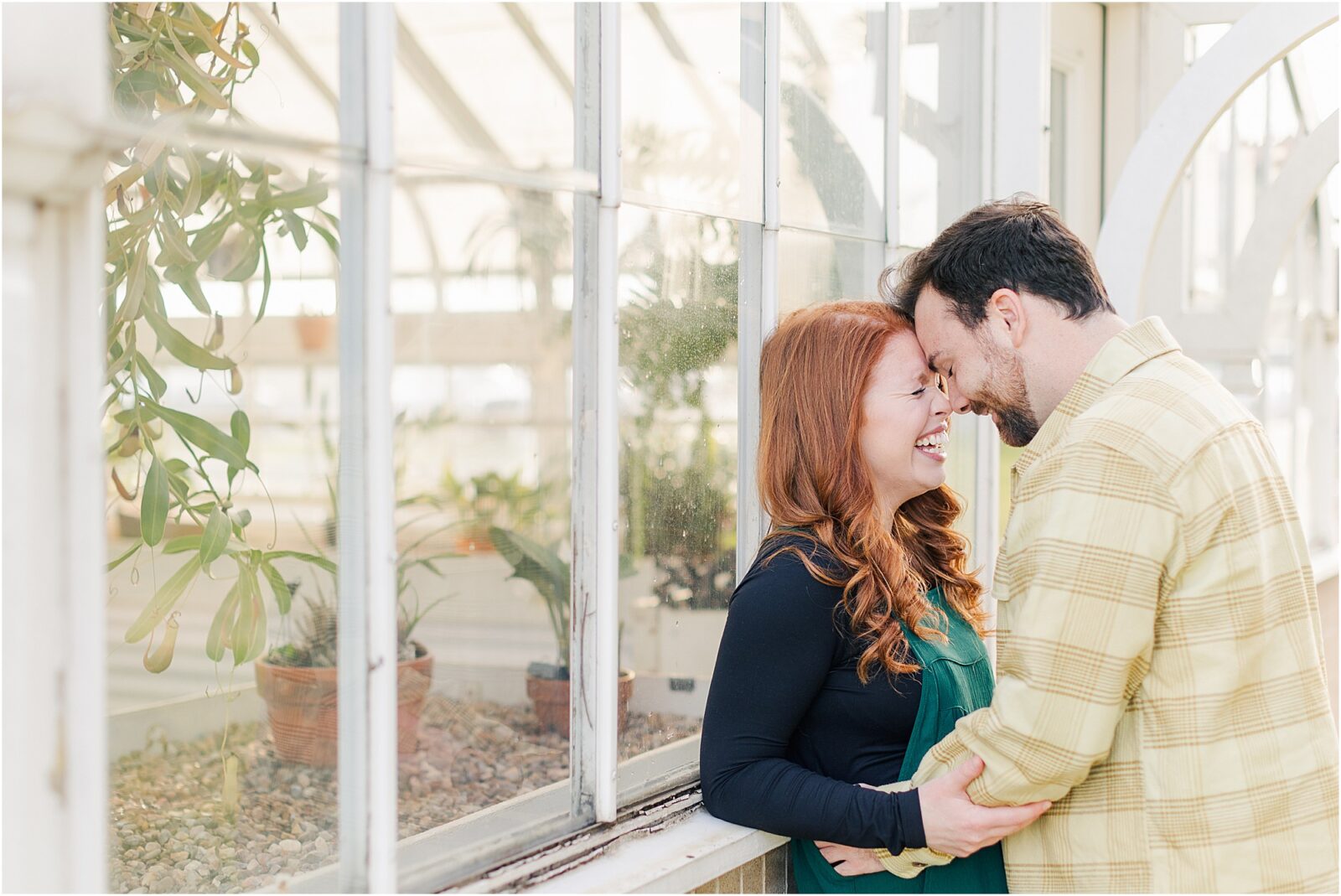 A garden engagement session at the greenhouse at woodward park.