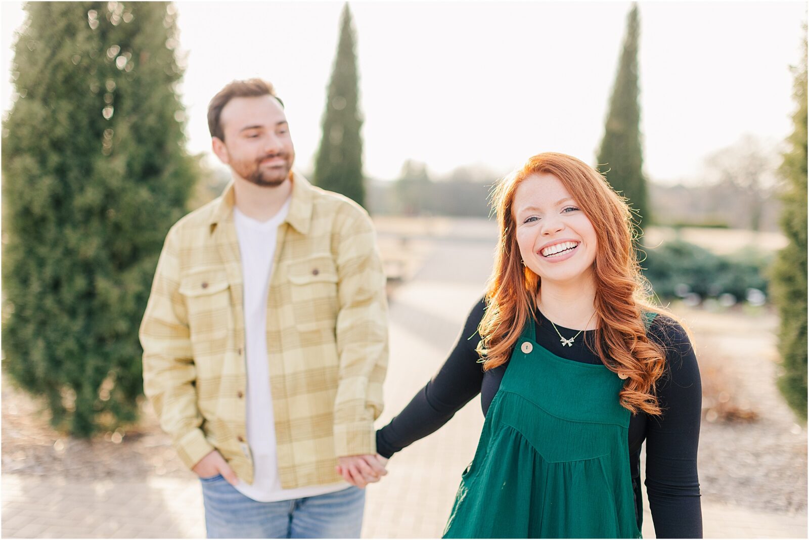 Walking through the garden at their woodward park engagement session.