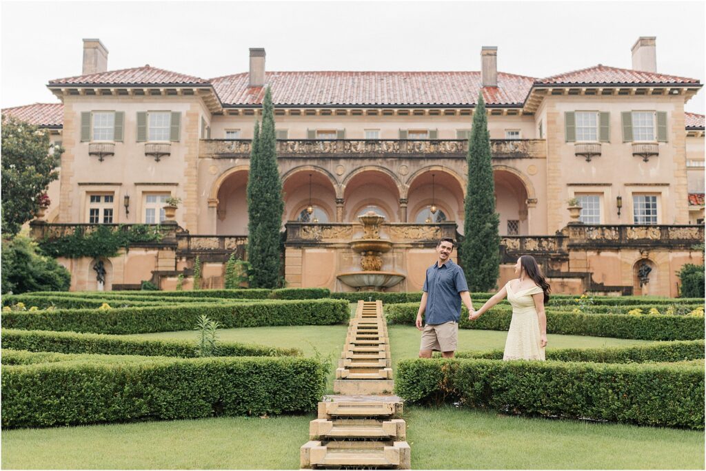 The iconic Philbrook Museum mansion on a rainy day during marie and mark's engagement session