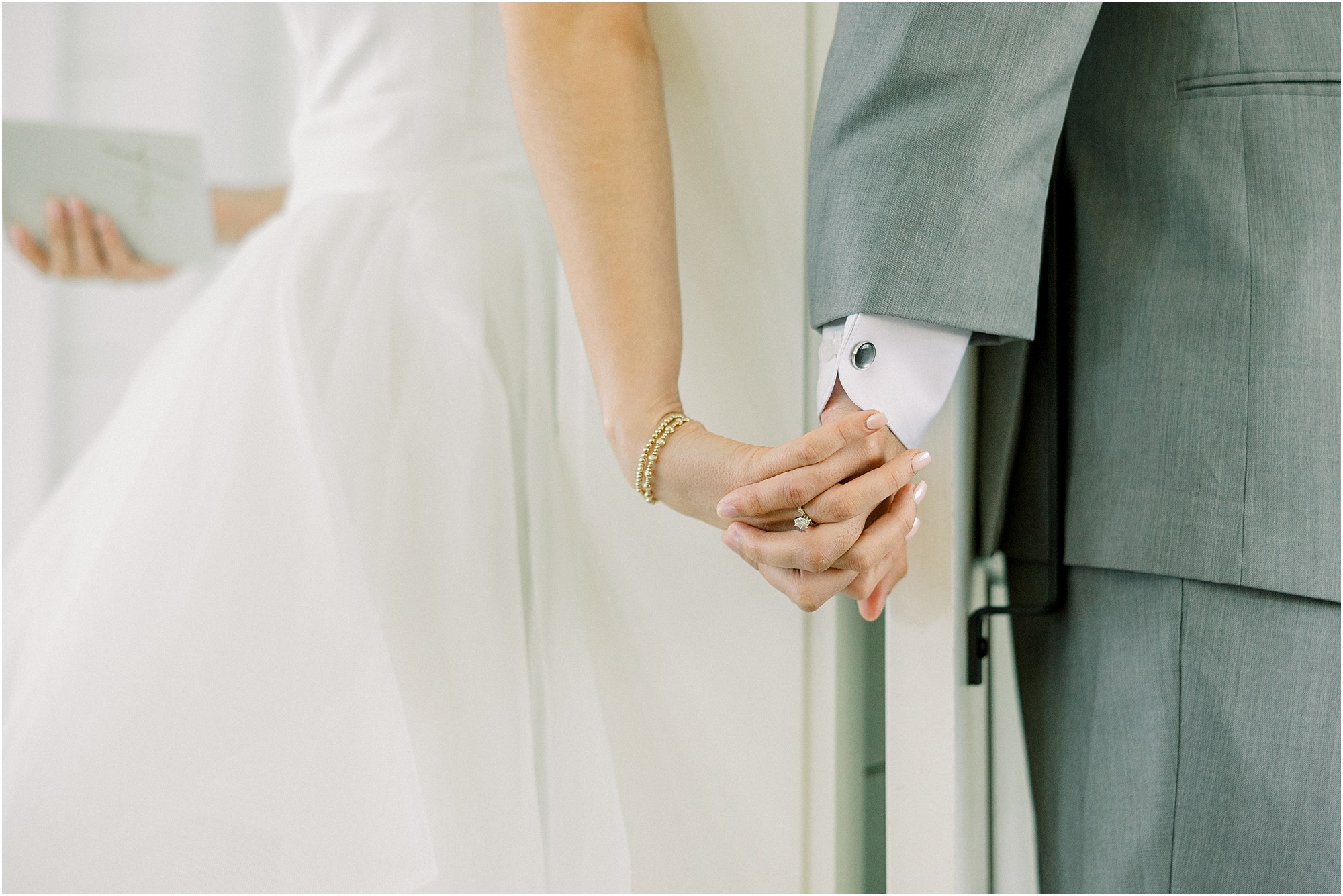 The bride and groom's first touch at Lakeview Hills.